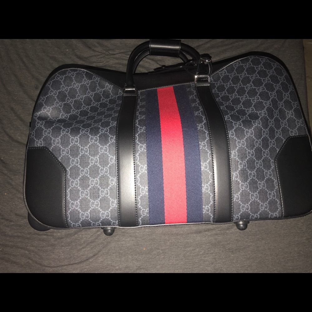 GG Black carry-on duffle with wheels